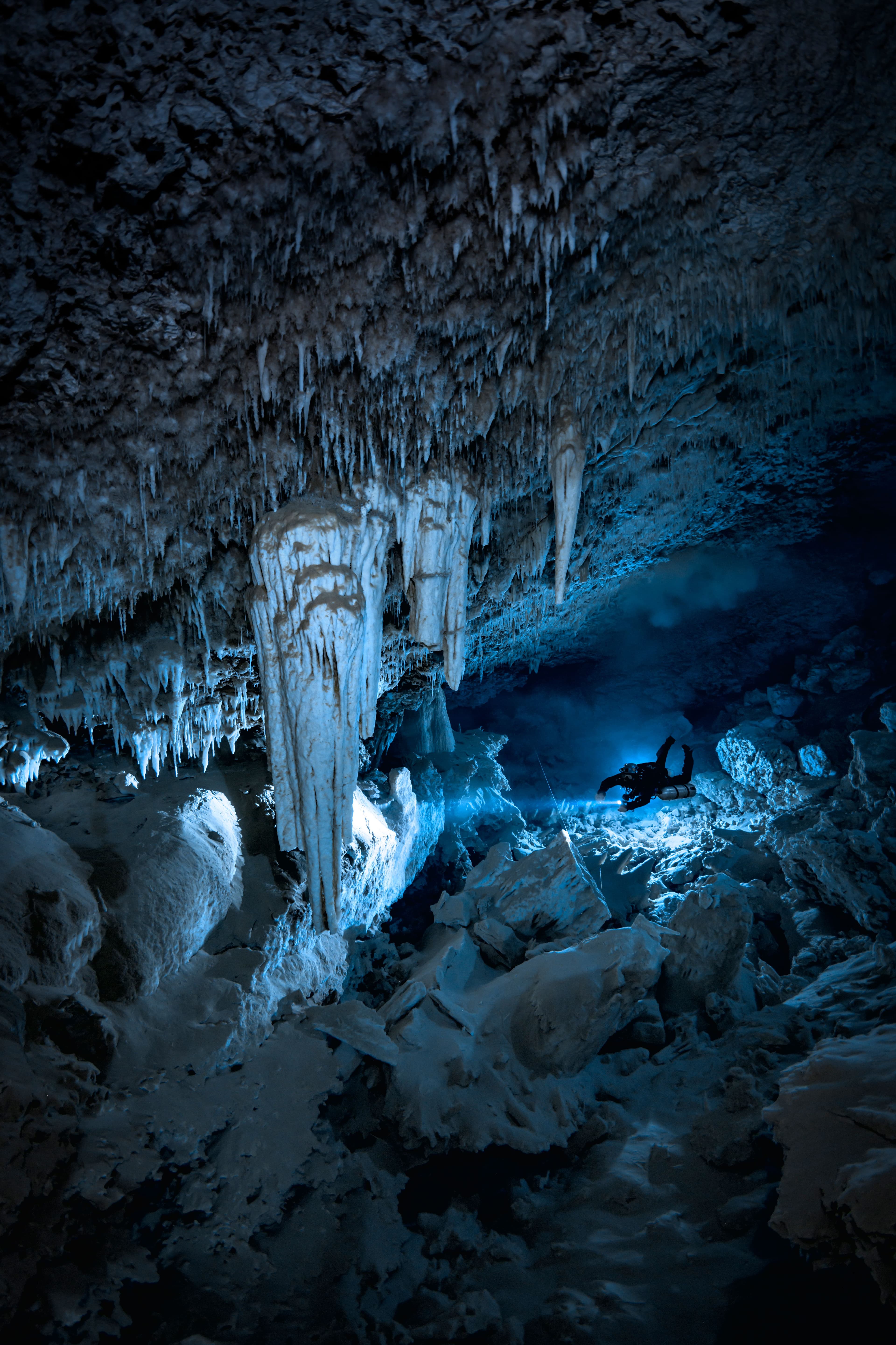 Divers in an underwater cave